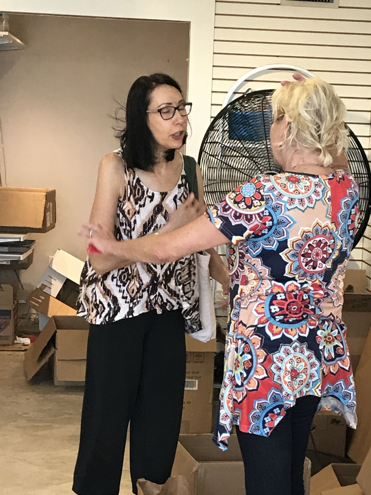 Toni Saul discusses her donations and process with.Jane Morris